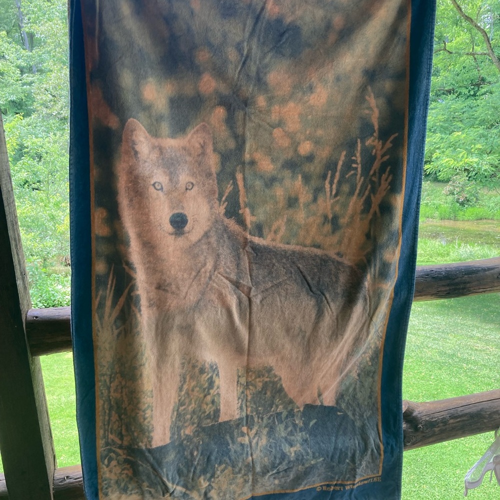 Extra large beach towel. Picture of the wolf, gold and gray blue in color.